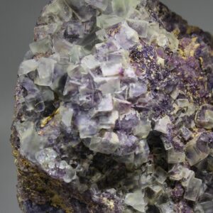 Close-up of pale green and purple fluorite cubes from Landsverk
