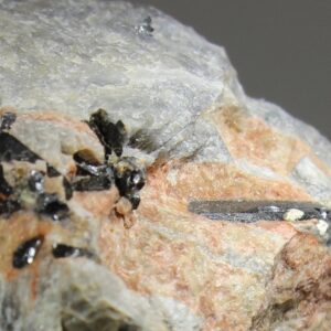 Elongated zirconolite crystals in pegmatite from Håkestad