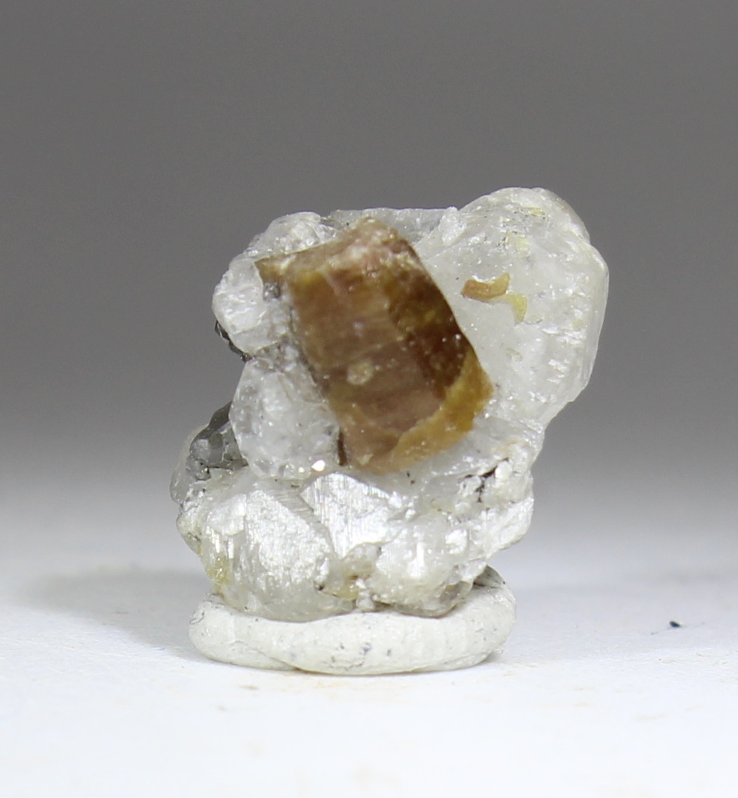 Parisite-(Ce) on calcite matrix from Muzo Colombia with brown crystal