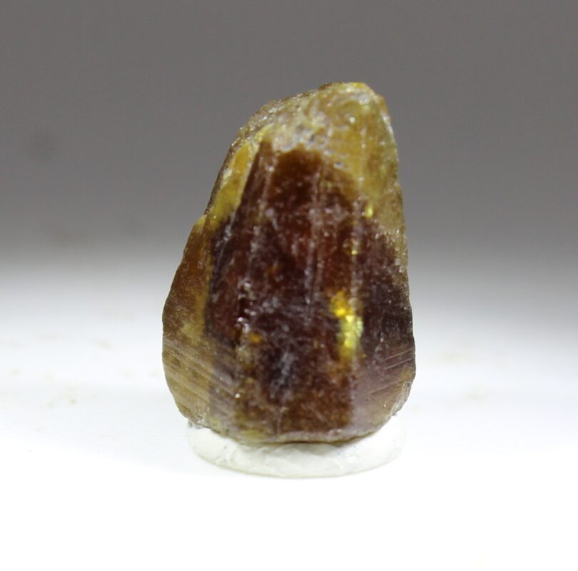 Stocky single Parisite-(Ce) crystal from Muzo with distinct color zoning from yellowish to reddish brown