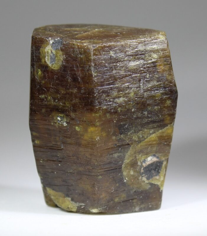 Stocky Parisite-(Ce) crystal from Muzo with a pseudohexagonal form and pronounced striations on the side faces