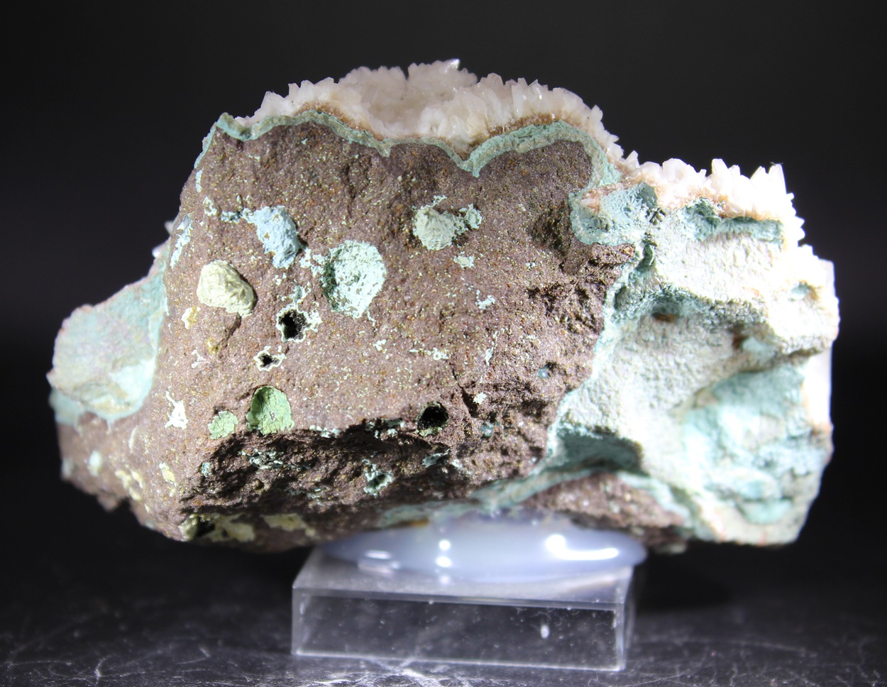 Calcite on basalt from the Raigad District India with white associated mineralization